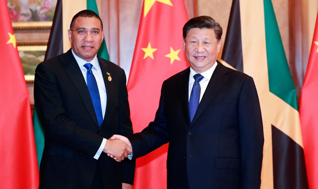 Xi meets Jamaican prime minister